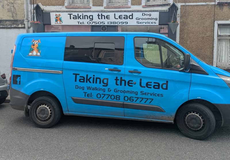 The Taking the Lead Groomers shopfront and branded van on Bridgend Road, Aberkenfig
